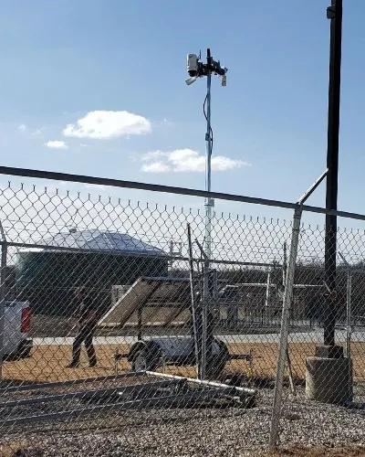 WCCTV surveillance Trailer Behind Fence - Thumb